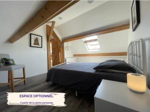 a bedroom with a bed and a desk in a room at Little Paradise - Comfort and Quiet Getaway by the Eure in Montreuil