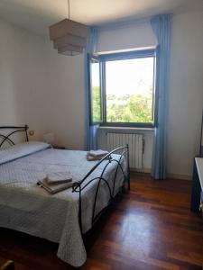Ένα ή περισσότερα κρεβάτια σε δωμάτιο στο Villa Ginevra +27 φωτογραφίες