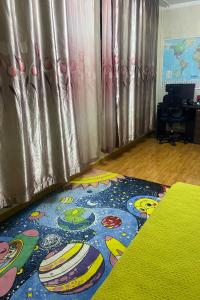 a room with a colorful rug on the floor at Crowne Residence in Ulaanbaatar