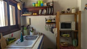 Kuchyň nebo kuchyňský kout v ubytování Casa Aloe nel cuore della sicilia