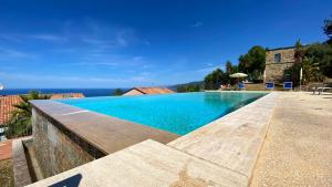 a swimming pool with a view of the ocean at Bellavista di Magarà in Cefalù