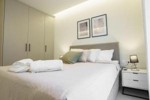 Giường trong phòng chung tại Ε&Α Luxury Apartment