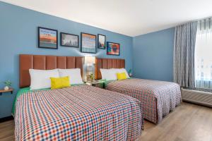 Voodi või voodid majutusasutuse Uptown Suites Extended Stay Austin TX - Downtown toas