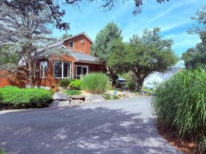 a house with a driveway in front of it at HIllside Farm B & B in Mount Joy