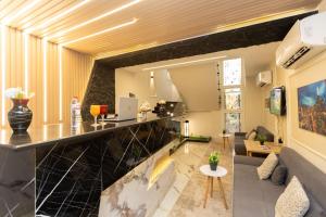 a living room with a bar and a couch at New dust pyramids hotel in Cairo