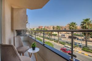 a balcony with a view of a city at New dust pyramids hotel in Cairo