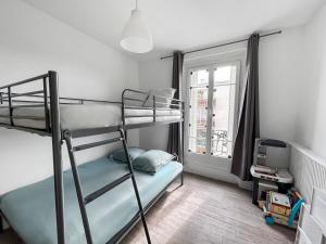 Ένα ή περισσότερα κρεβάτια σε δωμάτιο στο Appartement lumineux et spacieux avec 2 chambres