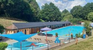 an overhead view of a large swimming pool with people in it at Ferienwohnung Annemarie in Gernsbach