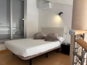 Cama o camas de una habitación en Loft Almagro