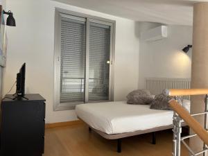 Cama o camas de una habitación en Loft Almagro