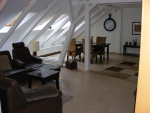 a living room with a couch and a table at Storchennest in Fischerhude