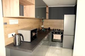 Η κουζίνα ή μικρή κουζίνα στο Superjednostka Silent West Apartment 2th floor, 48m2, city center, self check-in