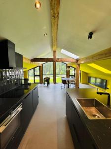 A kitchen or kitchenette at KWT Lodge