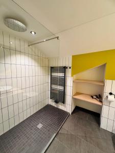 A bed or beds in a room at KWT Lodge