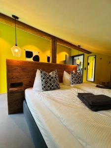 A bed or beds in a room at KWT Lodge