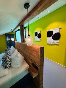 A bed or beds in a room at KWT Lodge