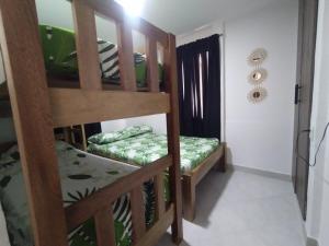 a room with two bunk beds in a room at Cabaña el cielo in Lorica