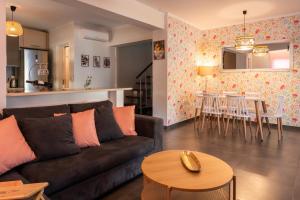 a living room with a couch and a table at Casa LIRIA - Χαλκίδα in Kánithos