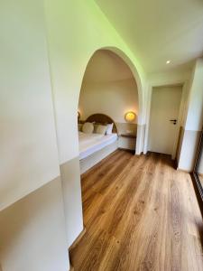 A bed or beds in a room at KWT Lodge