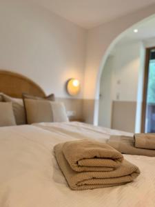A bed or beds in a room at KWT Lodge