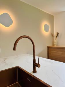 A bed or beds in a room at KWT Lodge