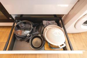a drawer full of kitchen utensils in a room at CDG • Mer de Sable • P.Asterix • Disney • Parking in Saint-Mard +32 photos