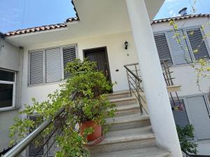 a set of stairs leading up to a house at Vila 3 in Berat