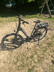 a bike parked on the ground in the grass at Zandvoort Boutique Apartments in Zandvoort
