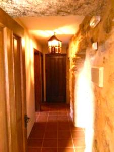 a hallway with a light and a light at A Casa do Aloumiño da Auga Mondariz VT-PO-00148 y SPA Prexigueiro Obsequio entrada por persona a circuito termal in San Félix