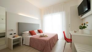 Postel nebo postele na pokoji v ubytování Hotel Pillon