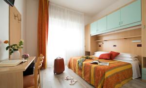Postel nebo postele na pokoji v ubytování Hotel Pillon