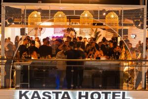 a crowd of people standing at a bar at Kasta Beach Hotel in Ofrínion