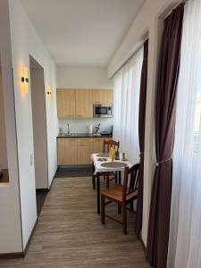 a kitchen and dining room with a table and chairs at Stylish and Comfortable - Your Apartment in Vienna