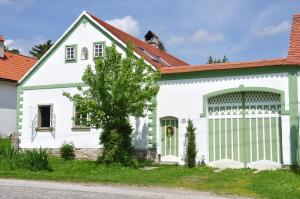 a white house with a red roof at Ubytování Česká Kanada in Český Rudolec