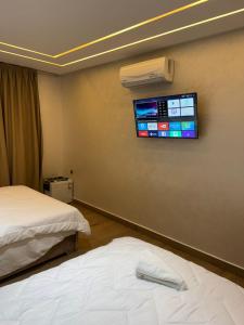 Voodi või voodid majutusasutuse HOTEL BORJ EL ARAB toas
