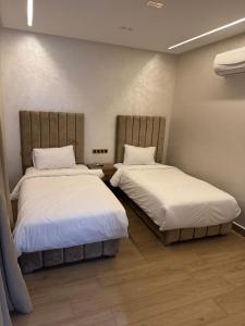 Voodi või voodid majutusasutuse HOTEL BORJ EL ARAB toas