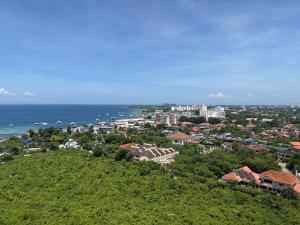 an aerial view of a city and the ocean at Tambuli Seaside Resort 16G - Lapu Lapu in Maribago