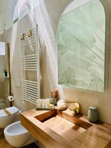 a bathroom with a sink and a toilet and a mirror at La Presentosa b&b in Fossacesia +135 photos