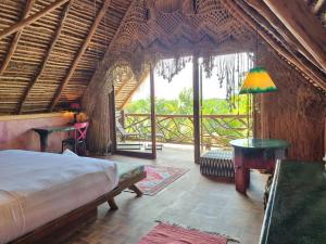Postel nebo postele na pokoji v ubytování HIPPIE CHIT jungle House