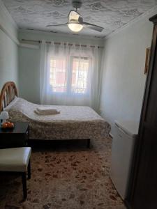 En eller flere senge i et værelse på Cozy room