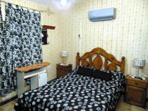 a bedroom with a bed in a room at Casa en Playas de Oro in Villa Carlos Paz