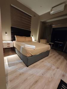 a bedroom with a large bed in a room at ARCHITECT's VIEW SUITE 1 in Durban +9 photos