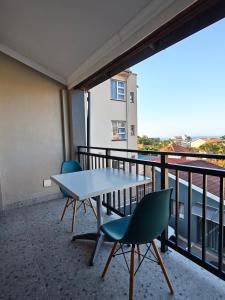 a table and chairs on a balcony with a view at ARCHITECT's VIEW SUITE 1 in Durban