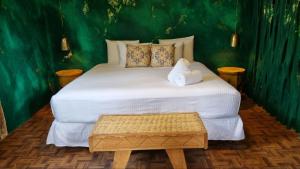 Postel nebo postele na pokoji v ubytování HIPPIE CHIT jungle House
