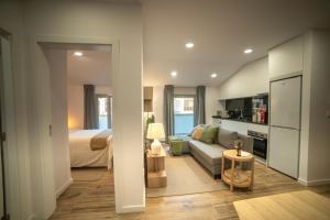 a living room with a couch and a bed at Charming Santo Antonio Roof top in Monção