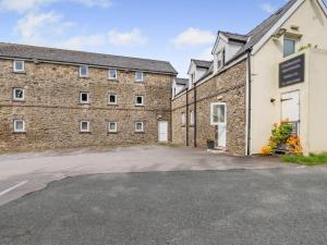 an empty parking lot in front of a brick building at 2 Bed in Cosheston FB060 in Cosheston
