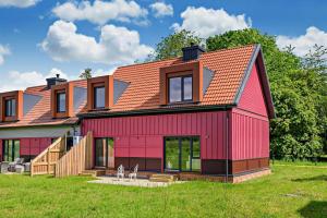 a red house with an orange roof at Ash View 2 in Corsley