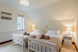 Voodi või voodid majutusasutuse Throop House Cottage - Bournemouth toas