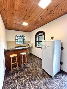Kuchyň nebo kuchyňský kout v ubytování Villaggio Harmonia Monte Verde
