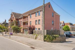 a brick house on the side of a street at Nellys in Swanage